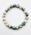 Faceted Silverite Ball Stretch Bracelet with a Sterling Silver Diamond Rondelle
