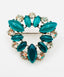 Vintage Rhinestone Clear and Green Glass Cabachon Prong Set Brooch from the 1950s